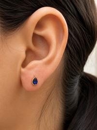 Arete gota de zafiro medio biselada en oro 14k