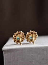 Arete de esmeralda con halo de diamantes en oro 14k