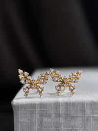 Aretes de mariposa con diamantes naturales en oro 14k