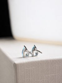 Aretes gota de aguamarina en oro blanco 14k