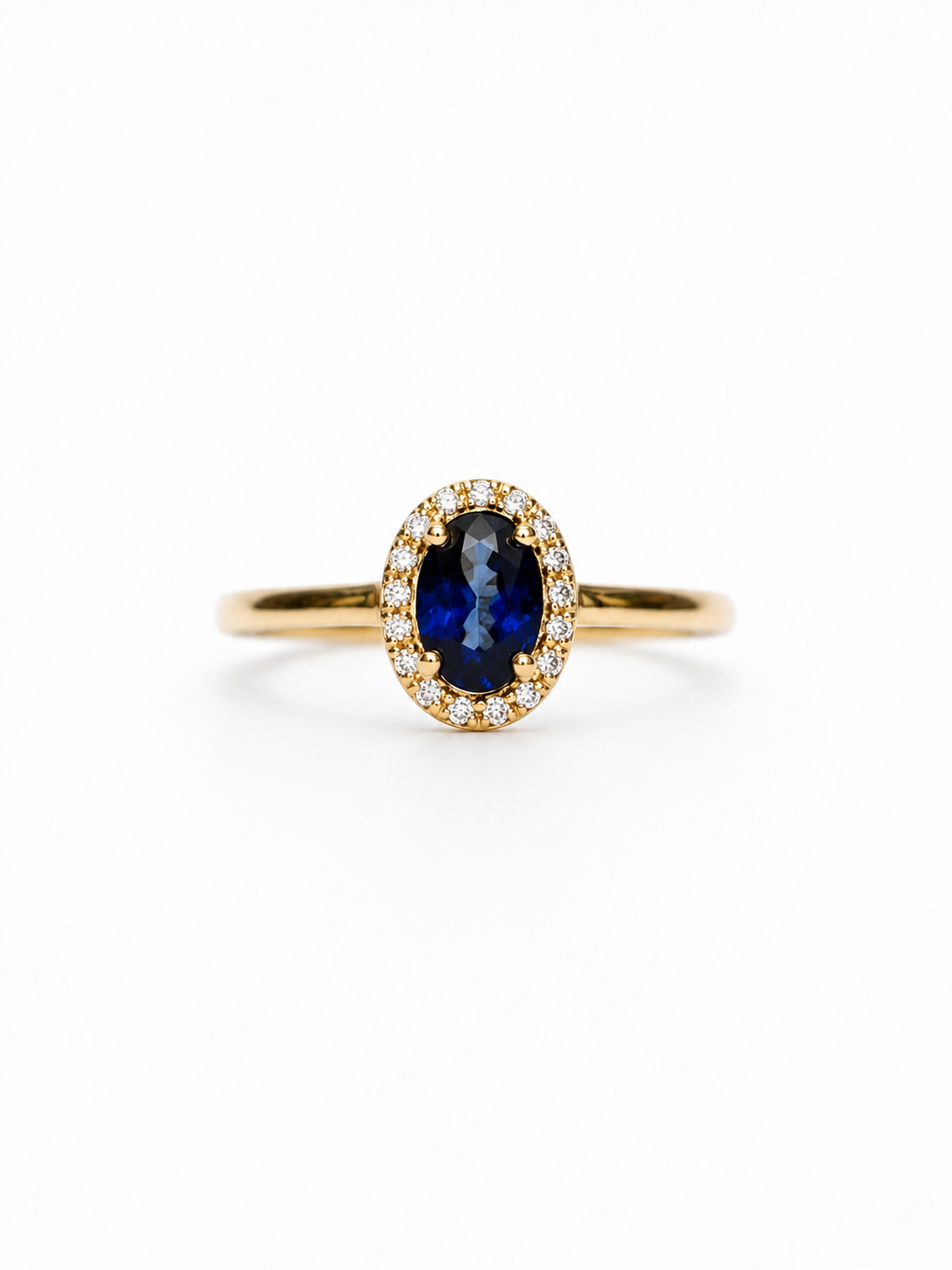 Anillo de zafiro oval con halo de diamantes en oro 14k