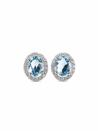 Arete oval de aguamarina con halo de diamantes en oro blanco 14k