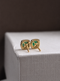 Aretes de esmeralda con halo de diamantes en oro 14k